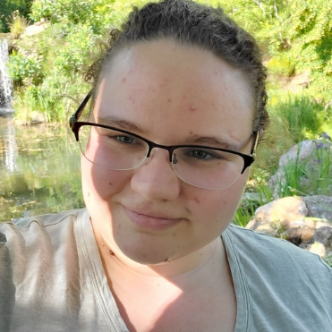 woman smiling with nature background